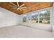 Spacious sunroom with wood ceiling, many windows, and tile floor at 535 Wildflower Trail, Myrtle Beach, SC 29579