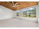 Bright sunroom with wood ceiling, tile floor and many windows with backyard views at 535 Wildflower Trail, Myrtle Beach, SC 29579