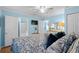 Comfortable bedroom with a full bed, blue walls, ceiling fan and multiple closets at 6001 - 1805 S Kings Hwy., Myrtle Beach, SC 29575