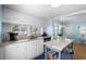 Eat-in kitchen featuring granite countertops, hardwood floors, and natural light at 6001 - 1805 S Kings Hwy., Myrtle Beach, SC 29575