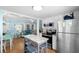 Well-lit kitchen that opens to the living and dining areas with stainless steel appliances and granite countertops at 6001 - 1805 S Kings Hwy., Myrtle Beach, SC 29575