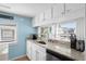 Modern kitchen with granite countertops, white cabinetry, and stainless-steel appliances at 6001 - 1805 S Kings Hwy., Myrtle Beach, SC 29575