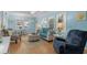 Inviting living room with a dining area, hardwood floors, and blue coastal accents at 6001 - 1805 S Kings Hwy., Myrtle Beach, SC 29575