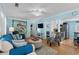 An open-concept living room with hardwood floors, ceiling fan, and easy access to the kitchen at 6001 - 1805 S Kings Hwy., Myrtle Beach, SC 29575