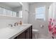 Bathroom with a vanity, mirror, toilet, and shower with a pink flamingo curtain with light walls and tiled floors at 6001-1454 S Kings Hwy., Myrtle Beach, SC 29575