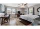 Bedroom featuring wood floors, a ceiling fan, two windows, and a small desk at 6001-1454 S Kings Hwy., Myrtle Beach, SC 29575