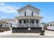 Charming two-story home featuring a cozy front porch and a beautifully maintained exterior at 6001-1454 S Kings Hwy., Myrtle Beach, SC 29575