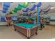 An entertainment game room with a pool table and an assortment of video games at 6001-1454 S Kings Hwy., Myrtle Beach, SC 29575