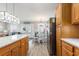 Bright kitchen featuring wood cabinets, stainless steel appliances, and an adjacent dining area with natural light at 6001-1454 S Kings Hwy., Myrtle Beach, SC 29575