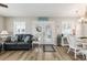 Bright living room features a cozy sofa, natural light, and stylish decor at 6001-1454 S Kings Hwy., Myrtle Beach, SC 29575