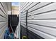 Outdoor shower featuring vertical white siding with a black base and surrounded by personal items at 6001-1454 S Kings Hwy., Myrtle Beach, SC 29575