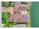 Aerial view of a beautiful waterfront home with a brick driveway, tile roof and outdoor patio at 603 Sea Island Way, North Myrtle Beach, SC 29582