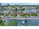 Picturesque waterfront home with lush landscaping, circular driveway, and scenic lake views and fountain at 603 Sea Island Way, North Myrtle Beach, SC 29582