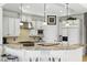 Modern kitchen with granite countertops, center island, stainless steel appliances, and ample cabinetry at 603 Sea Island Way, North Myrtle Beach, SC 29582