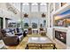 Luxurious living room with scenic water views, comfortable seating, and a cozy fireplace for relaxation at 603 Sea Island Way, North Myrtle Beach, SC 29582