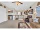 Upstairs entertainment area with a wet bar, mini-fridge, comfortable seating, and carpet flooring at 603 Sea Island Way, North Myrtle Beach, SC 29582