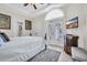 Cozy bedroom featuring a decorative rug, ceiling fan, and bright natural light with access to balcony at 603 Sea Island Way, North Myrtle Beach, SC 29582