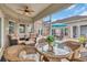 Outdoor patio with ample seating, lake views, and well-maintained landscaping, perfect for entertaining at 603 Sea Island Way, North Myrtle Beach, SC 29582
