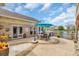 Back patio with outdoor seating, manicured landscaping, and a serene lake view in a beautiful community at 603 Sea Island Way, North Myrtle Beach, SC 29582