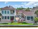Beautiful home featuring a brick exterior, patio with seating, and a lovely view of the water at 603 Sea Island Way, North Myrtle Beach, SC 29582