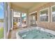 Inviting sunroom featuring a relaxing hot tub and easy access to an outdoor patio for ultimate relaxation at 603 Sea Island Way, North Myrtle Beach, SC 29582