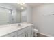 Well-lit bathroom with a large mirror, vanity, and a shower featuring a white shower stall at 608 Woodside Dr., Conway, SC 29526