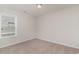 Bedroom with a large window and neutral carpeting, offering a relaxing and comfortable atmosphere at 608 Woodside Dr., Conway, SC 29526