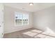 Bright bedroom with a window offering natural light and views of the surrounding neighborhood at 608 Woodside Dr., Conway, SC 29526