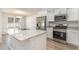 Stylish kitchen with stainless steel appliances, granite countertops, and white cabinetry at 608 Woodside Dr., Conway, SC 29526