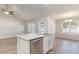 Modern kitchen featuring a granite island with stainless steel appliances and hardwood floors at 608 Woodside Dr., Conway, SC 29526