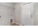 Bright laundry room featuring modern shelving and a sleek utility sink for added convenience at 608 Woodside Dr., Conway, SC 29526