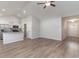 Open concept living area with vaulted ceilings, hardwood floors, and a view of the kitchen at 608 Woodside Dr., Conway, SC 29526