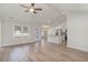 Bright and airy living room with hardwood floors that flows into an open-concept kitchen at 608 Woodside Dr., Conway, SC 29526