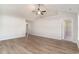 Spacious living room featuring hardwood floors, a ceiling fan, and neutral wall colors at 608 Woodside Dr., Conway, SC 29526