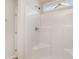Clean and modern shower with white tile, a built-in seat, and a window for natural light at 608 Woodside Dr., Conway, SC 29526