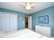 Bright bedroom featuring a closet, a ceiling fan, and a dresser with a neutral color scheme, creating a serene retreat at 6172 Catalina Dr. # 515, North Myrtle Beach, SC 29582