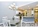 Open floor plan featuring a dining area with stylish chandelier, connecting to a modern kitchen with stainless steel appliances at 6172 Catalina Dr. # 515, North Myrtle Beach, SC 29582