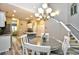 Open layout featuring a dining area with a modern chandelier, seamlessly connected to a contemporary kitchen at 6172 Catalina Dr. # 515, North Myrtle Beach, SC 29582