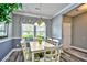Bright dining room featuring a white dining table, chandelier and chair railing for a warm and inviting atmosphere at 6172 Catalina Dr. # 515, North Myrtle Beach, SC 29582