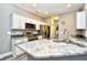Modern kitchen featuring granite countertops, stainless steel appliances, white cabinets and modern fixtures at 6172 Catalina Dr. # 515, North Myrtle Beach, SC 29582