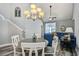 Inviting living room featuring vaulted ceilings, a large chandelier, with an open view of a dining area and living room at 6172 Catalina Dr. # 515, North Myrtle Beach, SC 29582