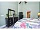 Primary bedroom with green walls, high ceiling, dark furniture, tv, and en suite bathroom at 6172 Catalina Dr. # 515, North Myrtle Beach, SC 29582