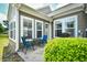 Charming patio with outdoor seating, grill, and access door perfect for entertaining guests at 6172 Catalina Dr. # 515, North Myrtle Beach, SC 29582