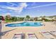 Inviting community pool with lounge chairs, umbrellas and lake views at 6172 Catalina Dr. # 515, North Myrtle Beach, SC 29582