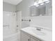 Bathroom features a shower over bath with a tiled backsplash and modern sink and mirror at 6304 Timberline Dr. # B, Myrtle Beach, SC 29572
