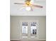 Bedroom offers a fan and double doors to a bright outdoors at 6304 Timberline Dr. # B, Myrtle Beach, SC 29572