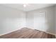 This bedroom features modern flooring, a ceiling fan, and ample closet space for storage at 6304 Timberline Dr. # B, Myrtle Beach, SC 29572
