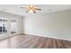Bedroom offers a fan, neutral walls and laminated floors with backyard access at 6304 Timberline Dr. # B, Myrtle Beach, SC 29572