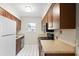 Cozy kitchen featuring stainless steel appliances, tile backsplash, and plenty of cabinet space at 6304 Timberline Dr. # B, Myrtle Beach, SC 29572
