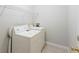 Laundry room includes side by side washer and dryer with wire shelving at 6304 Timberline Dr. # B, Myrtle Beach, SC 29572